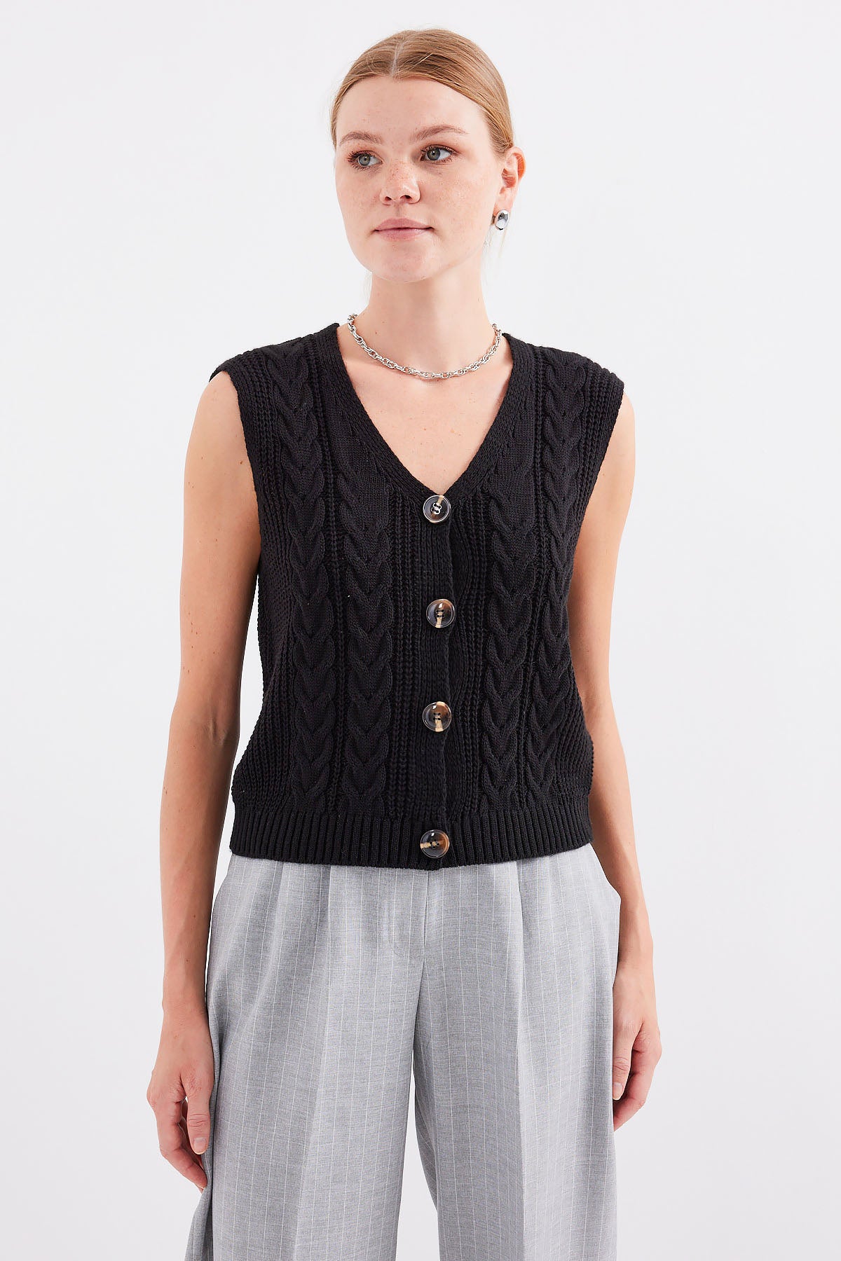 <tc>Gilet en tricot à boutons court 15882.</tc>