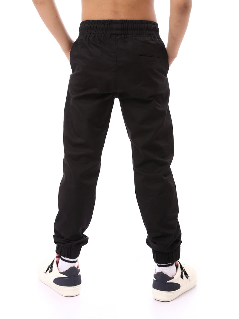 Pantalon de survêtement pour garçon avec taille élastique, au design pratique et confortable – JOG23SGBS24246TB1