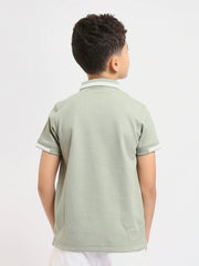 Polo enfant au design moderne et à la couleur douce – POS24SNTR21762TB1