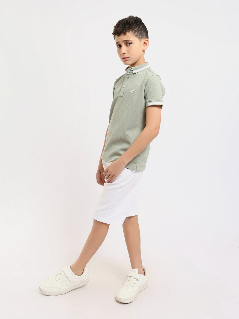 Polo enfant au design moderne et à la couleur douce – POS24SNTR21762TB1