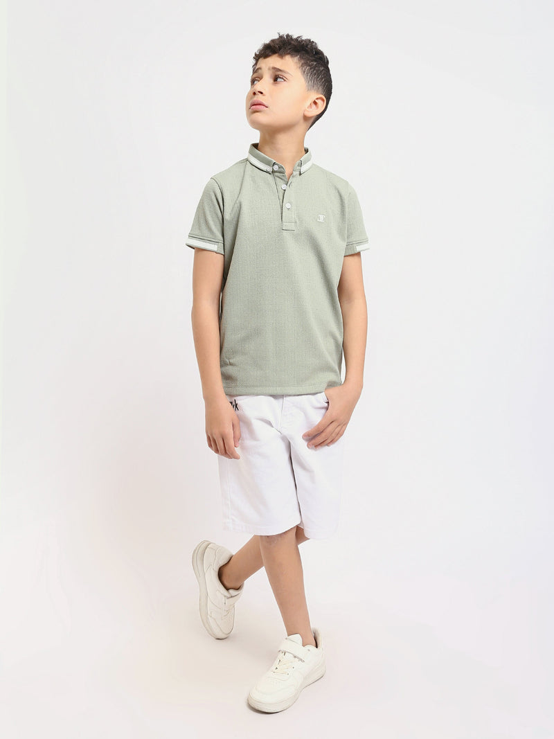 Polo enfant au design moderne et à la couleur douce – POS24SNTR21762TB1