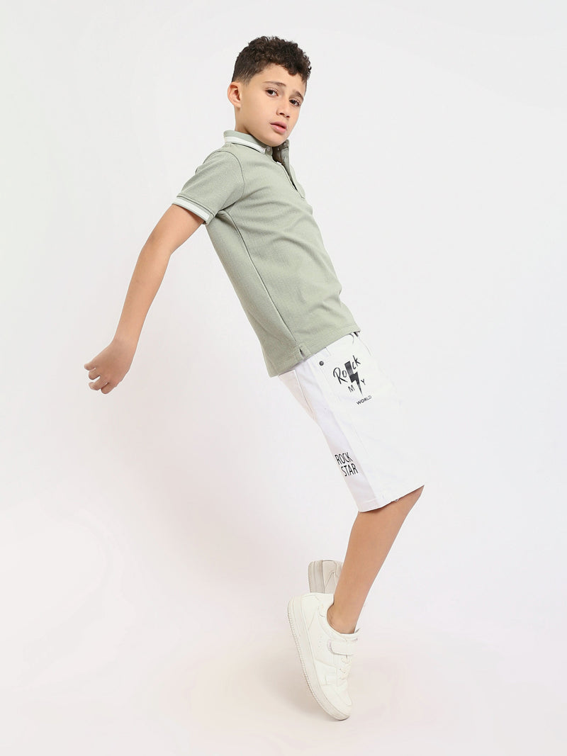 Polo enfant au design moderne et à la couleur douce – POS24SNTR21762TB1