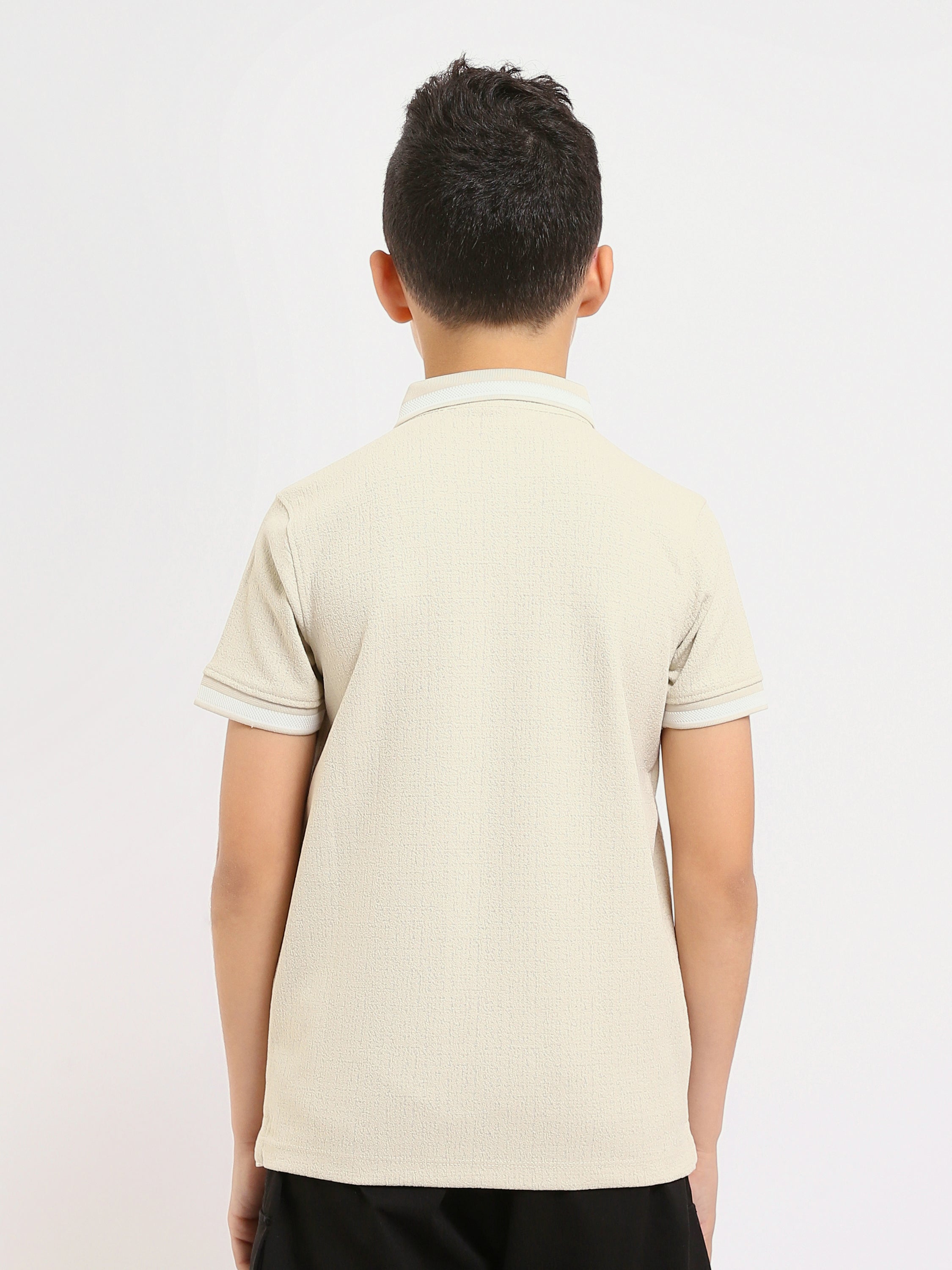 Polo enfant au design moderne et à la couleur douce – POS24SNTR21762TB1