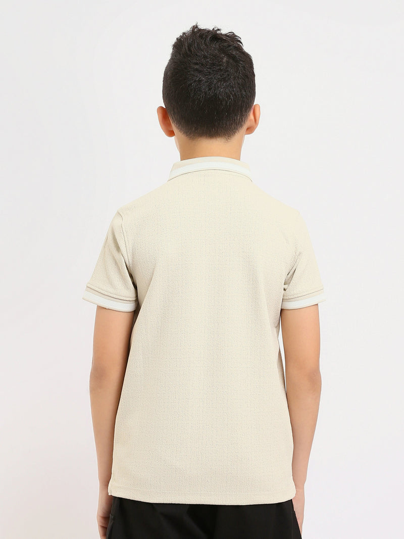 Polo enfant au design moderne et à la couleur douce – POS24SNTR21762TB1