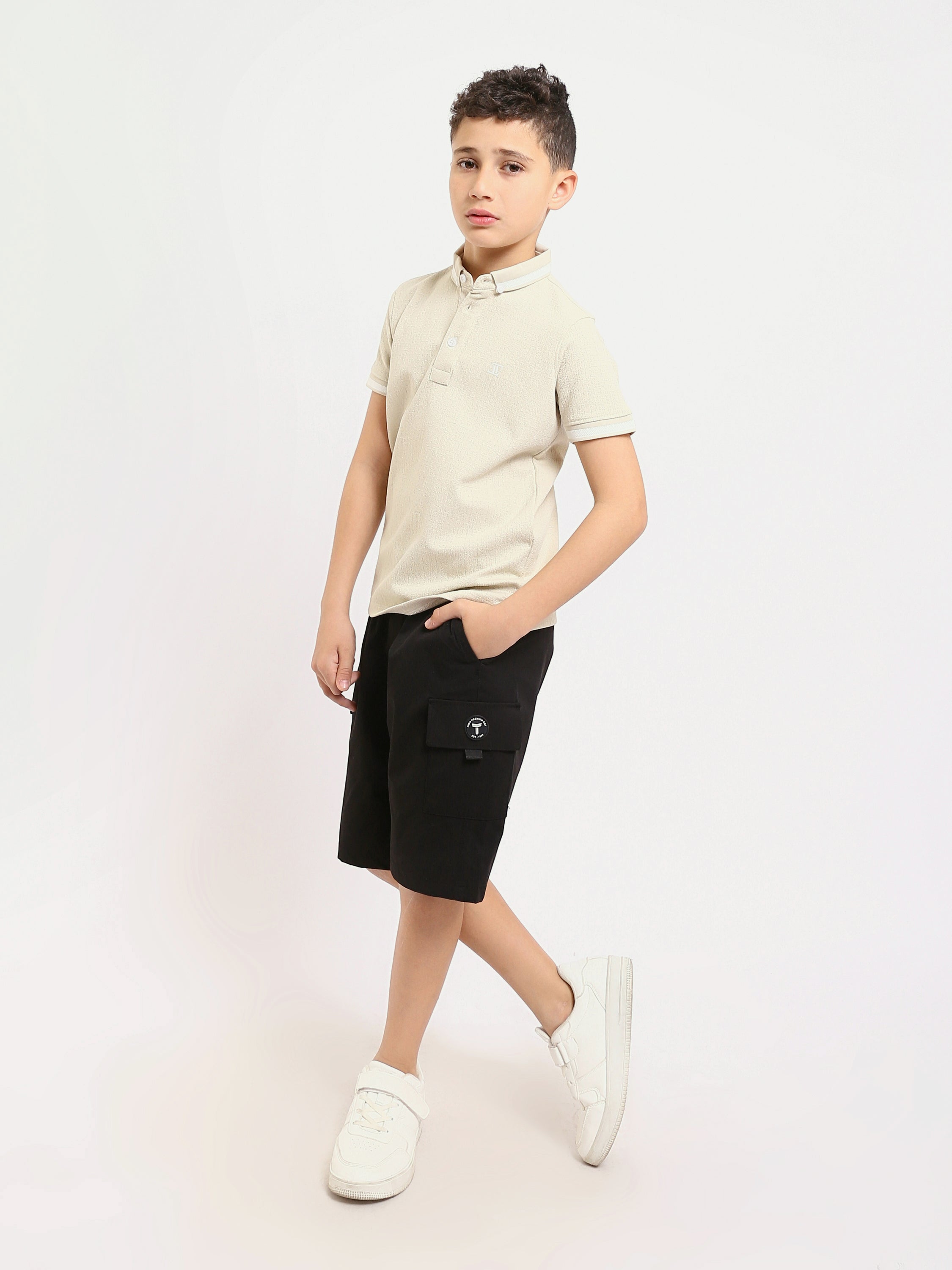 Polo enfant au design moderne et à la couleur douce – POS24SNTR21762TB1