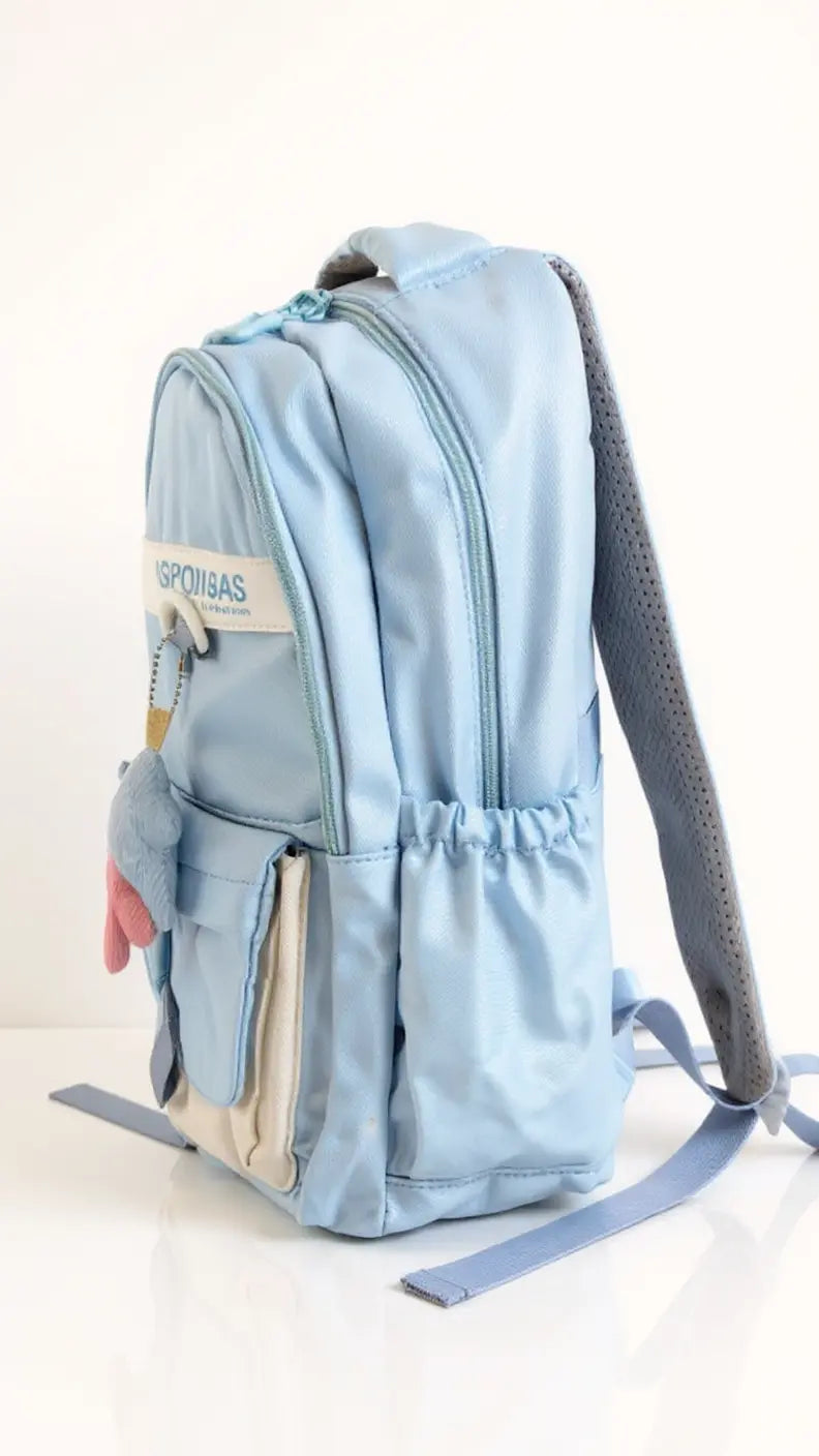 Sac à dos scolaire casual – Couleurs variées & petit accessoire tendance !