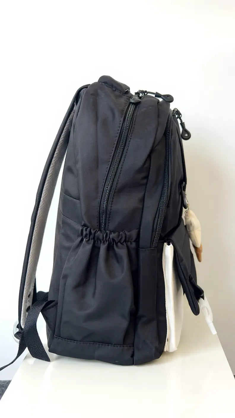 Sac à dos scolaire casual – Couleurs variées & petit accessoire tendance !