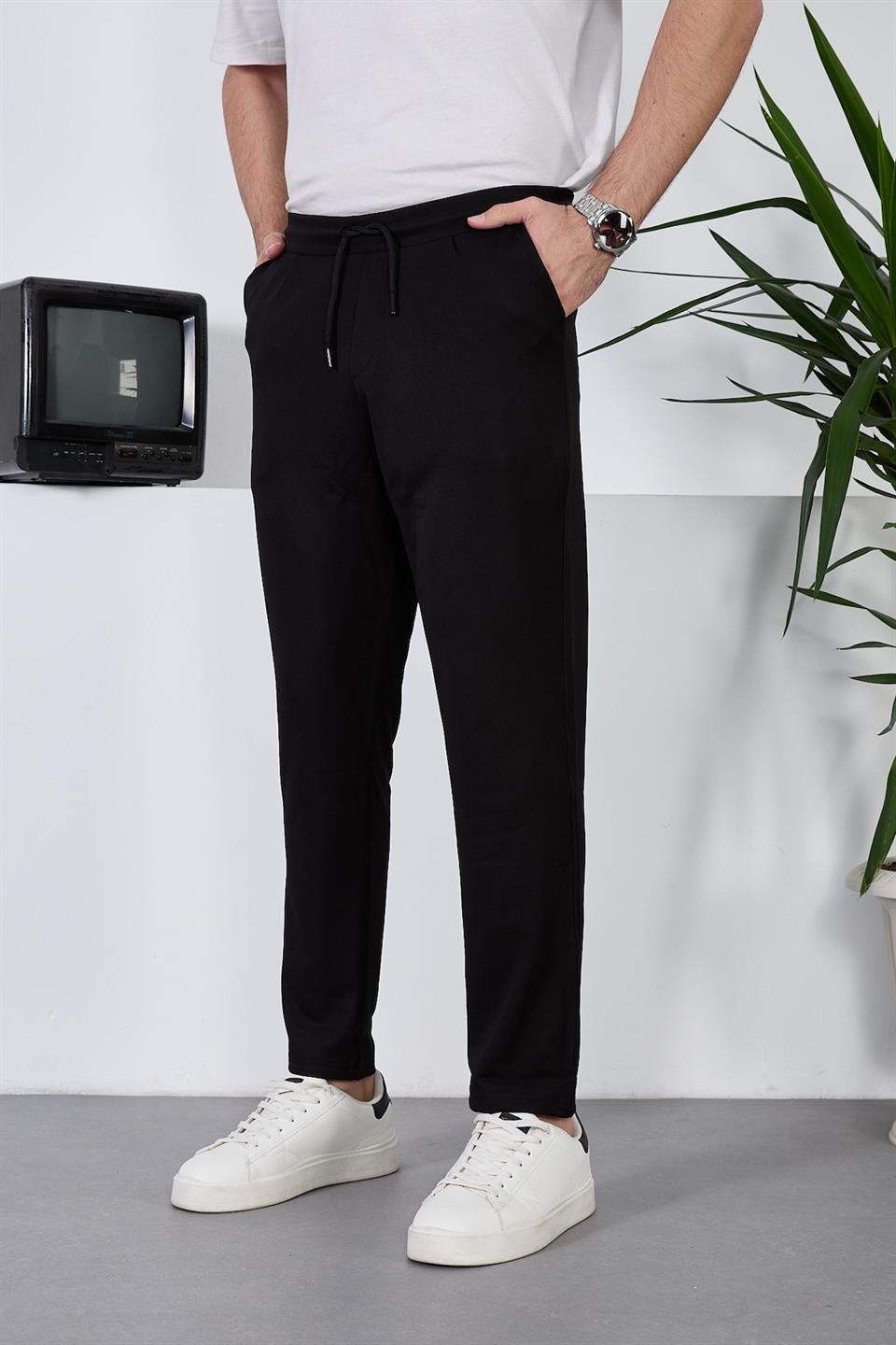 <tc>Pantalon pour homme léger et respirant en tissu diagonal avec taille élastique.</tc>