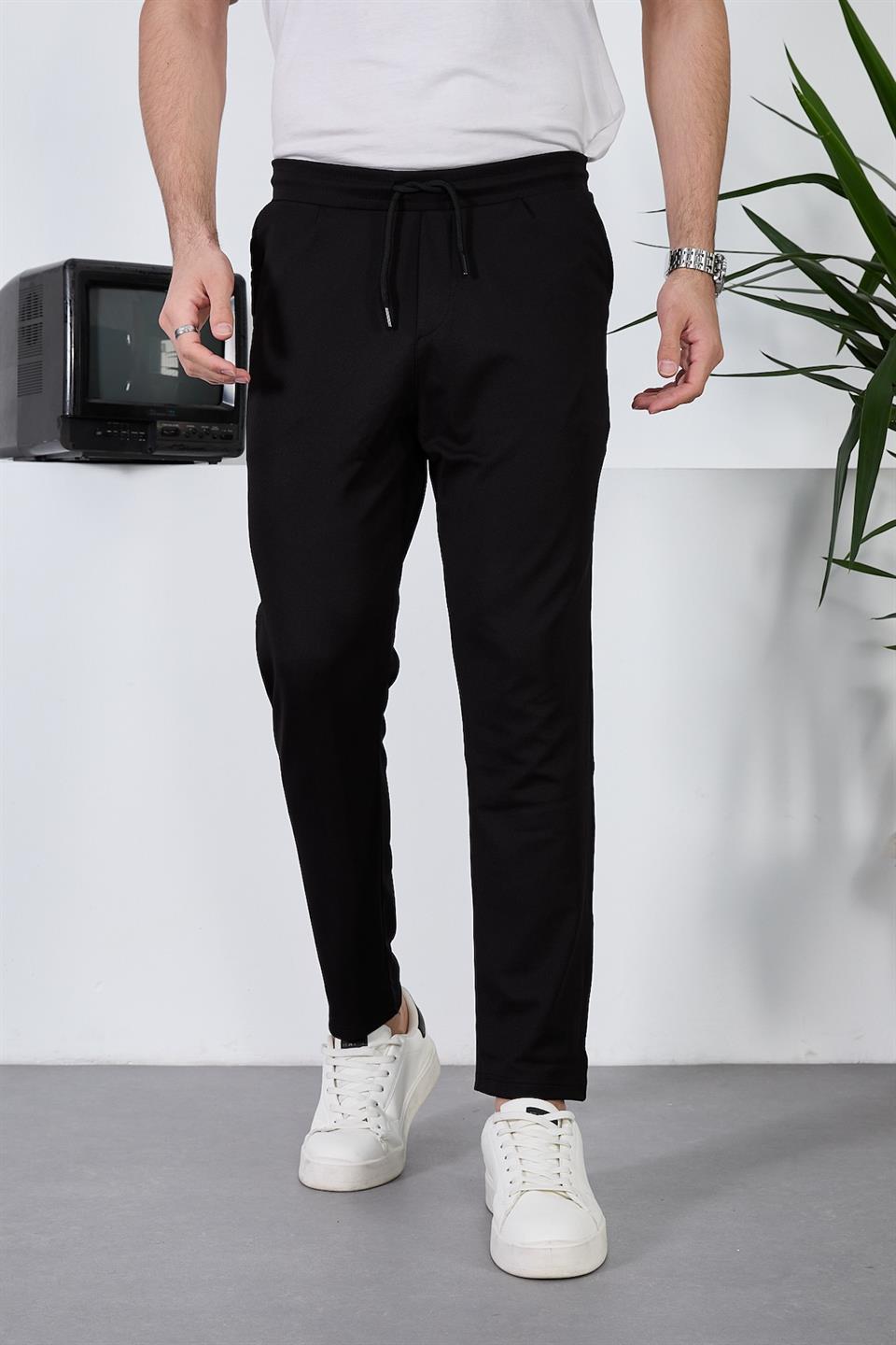 <tc>Pantalon pour homme léger et respirant en tissu diagonal avec taille élastique.</tc>