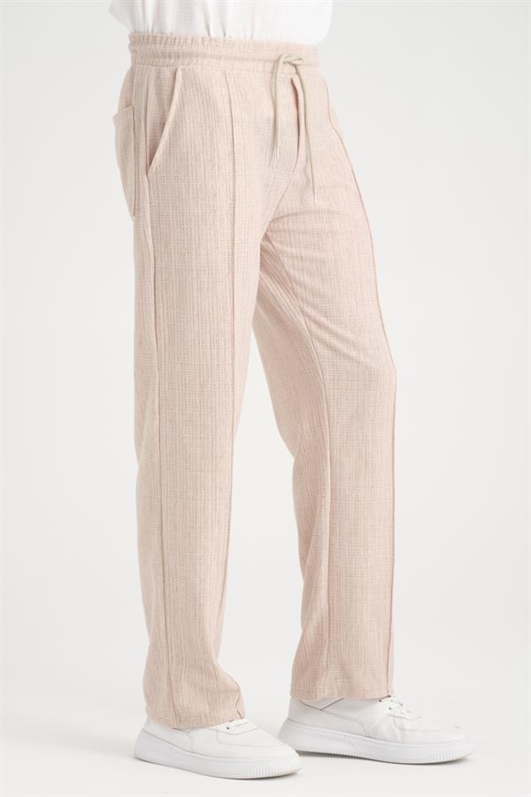 <tc>Pantalon baggy à taille élastique avec un design uni et une coupe confortable.</tc>