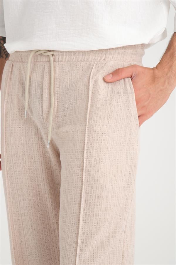 <tc>Pantalon baggy à taille élastique, coupe décontractée avec motif uni.</tc>