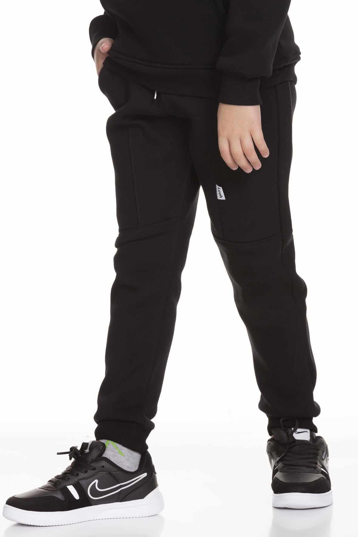 <tc>Pantalon de survêtement unisexe pour enfant avec poches et coupe jogger épaisse</tc>