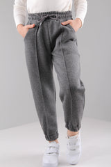 <tc>Pantalon de jogging unisexe pour enfants avec taille élastiquée, intérieur en polaire et poches</tc>