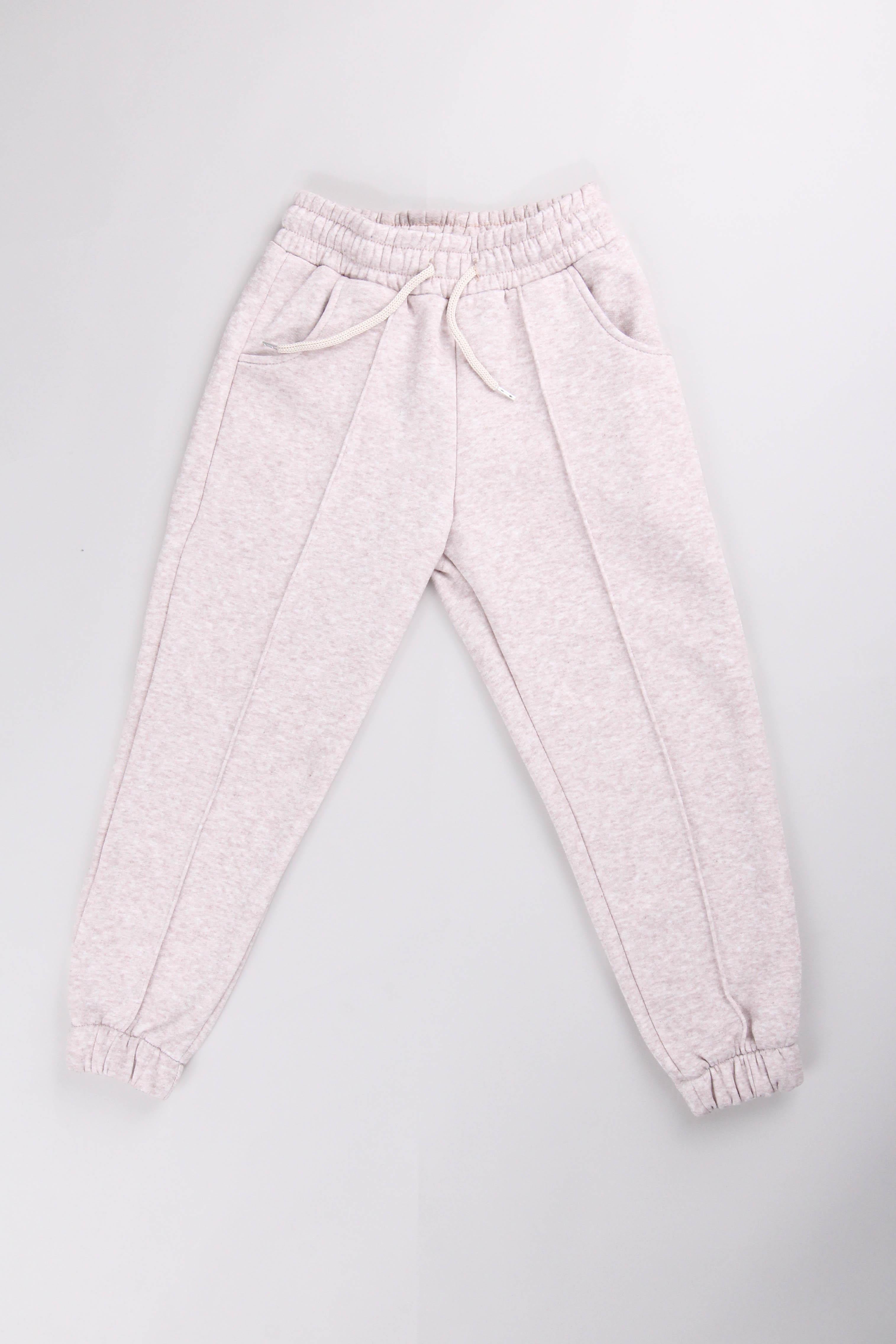 <tc>Pantalon de jogging unisexe pour enfants avec taille élastiquée, intérieur en polaire et poches</tc>