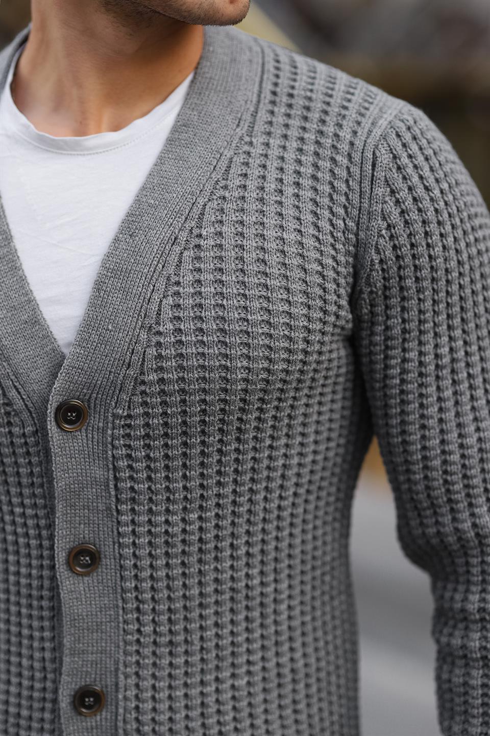 <tc>Cardigan en maille côtelée avec boutons et poches.</tc>