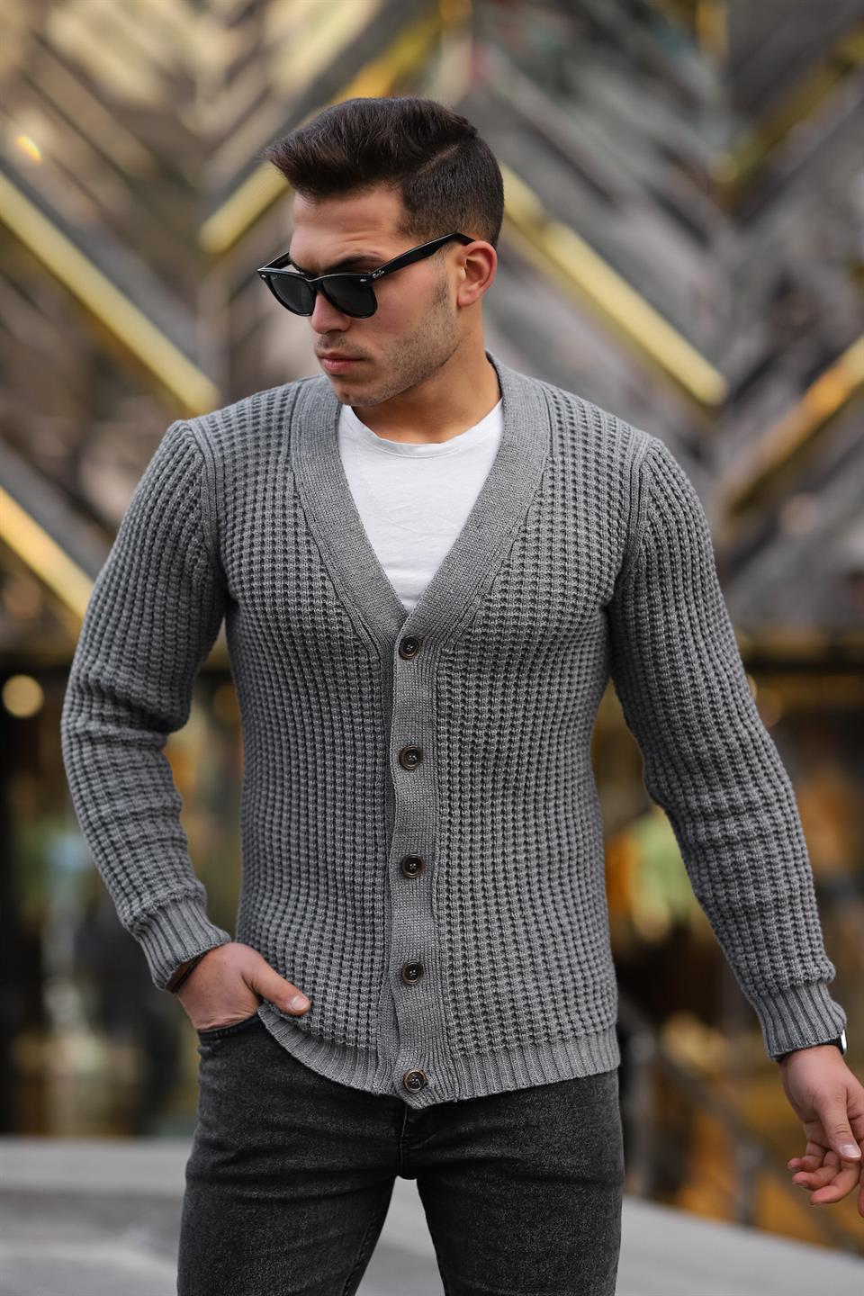 <tc>Cardigan en maille côtelée avec boutons et poches.</tc>