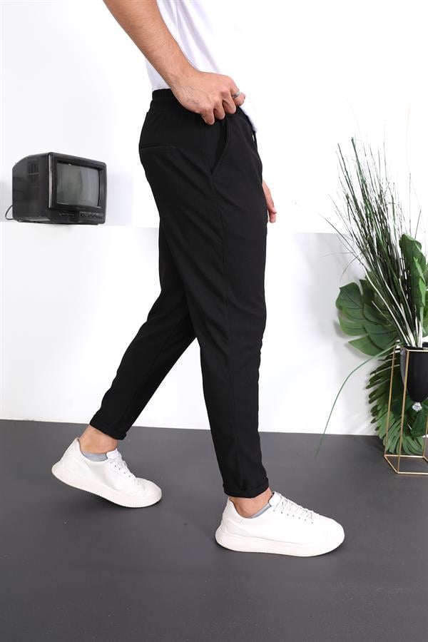 <tc>Pantalon ajusté à double ourlet avec texture premium.</tc>