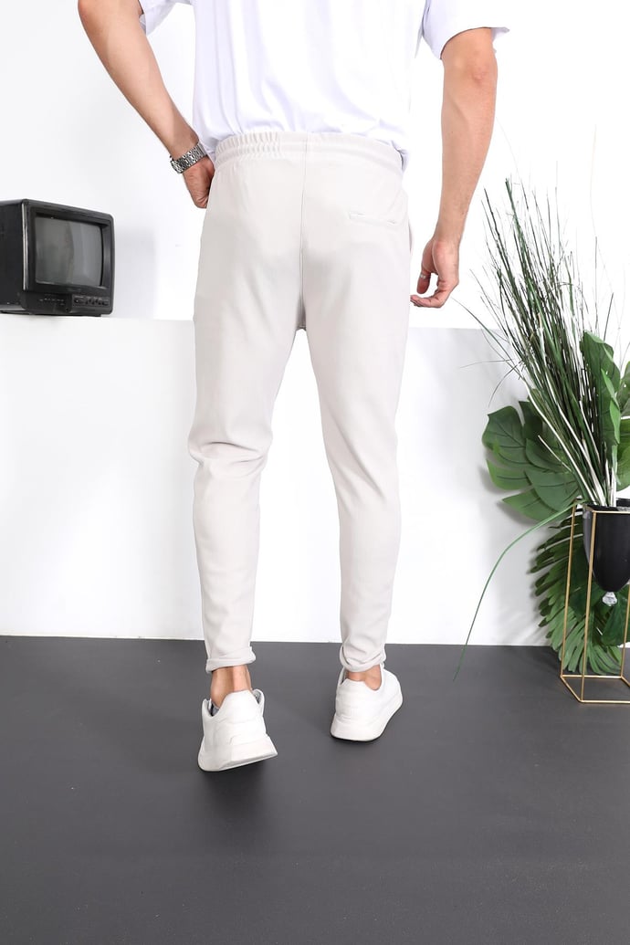 <tc>Pantalon fit à double jambe avec texture premium.</tc>