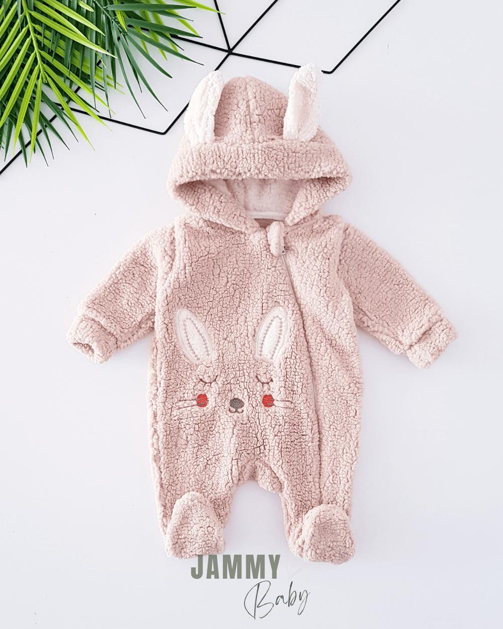 Combi-peluche bébé avec capuche et oreilles de lapin